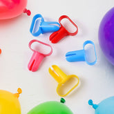 Ergonomic balloon tying tool set in white plastic