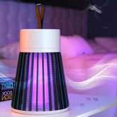 A black and white Mosquito Killer Lamp with purple light sits on a white table in a bedroom with flying mosquitoes.