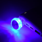 A diamond-shaped USB light glows bright blue while plugged into a white power bank.