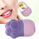 A purple and pink paw-shaped silicone ice roller and a clear ice roller with flowers, next to a woman's face.