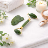 Jade face roller and gua sha set displayed on a light background