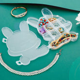 Transparent bear shaped jewelry organizer with a soft protective pad inside, ideal for small items