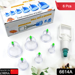 A vacuum cupping set with a white box, six clear cups with green tops, and a white pump with a green tip.