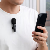 Compact wireless live streaming microphone with clip for mobile phones.