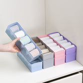 Clear plastic organizer tray with multiple compartments for beads and small craft items.