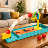 Top view of a miniature desktop basketball game set with a ball