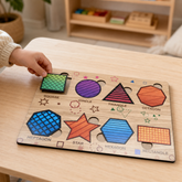 Wooden triangle puzzle with multiple colourful pieces on a light wooden board