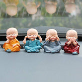 Adorable Baby Buddha showpiece set with four monk statues, perfect for home decor.