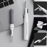 A 3-in-1 earbuds cleaning pen with its components displayed, ready for use.