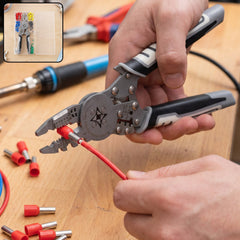 A person's hands holding a gray and black wire crimping tool, attaching a red connector to a red wire.