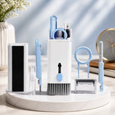 A white and light blue 7-in-1 electronic cleaning kit with various tools displayed on a white stand.
