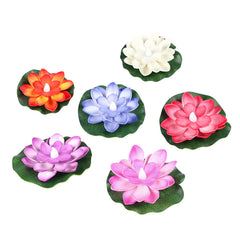A collection of six colorful lotus-shaped LED candles, each with a green lily pad base, displayed on a clean white