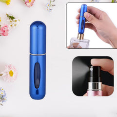 A hand holds a pink perfume atomizer, demonstrating the fine mist spray from its nozzle.