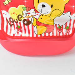 Detail of the bottom of the red bib, highlighting the integrated plastic food catcher and strawberry graphics.