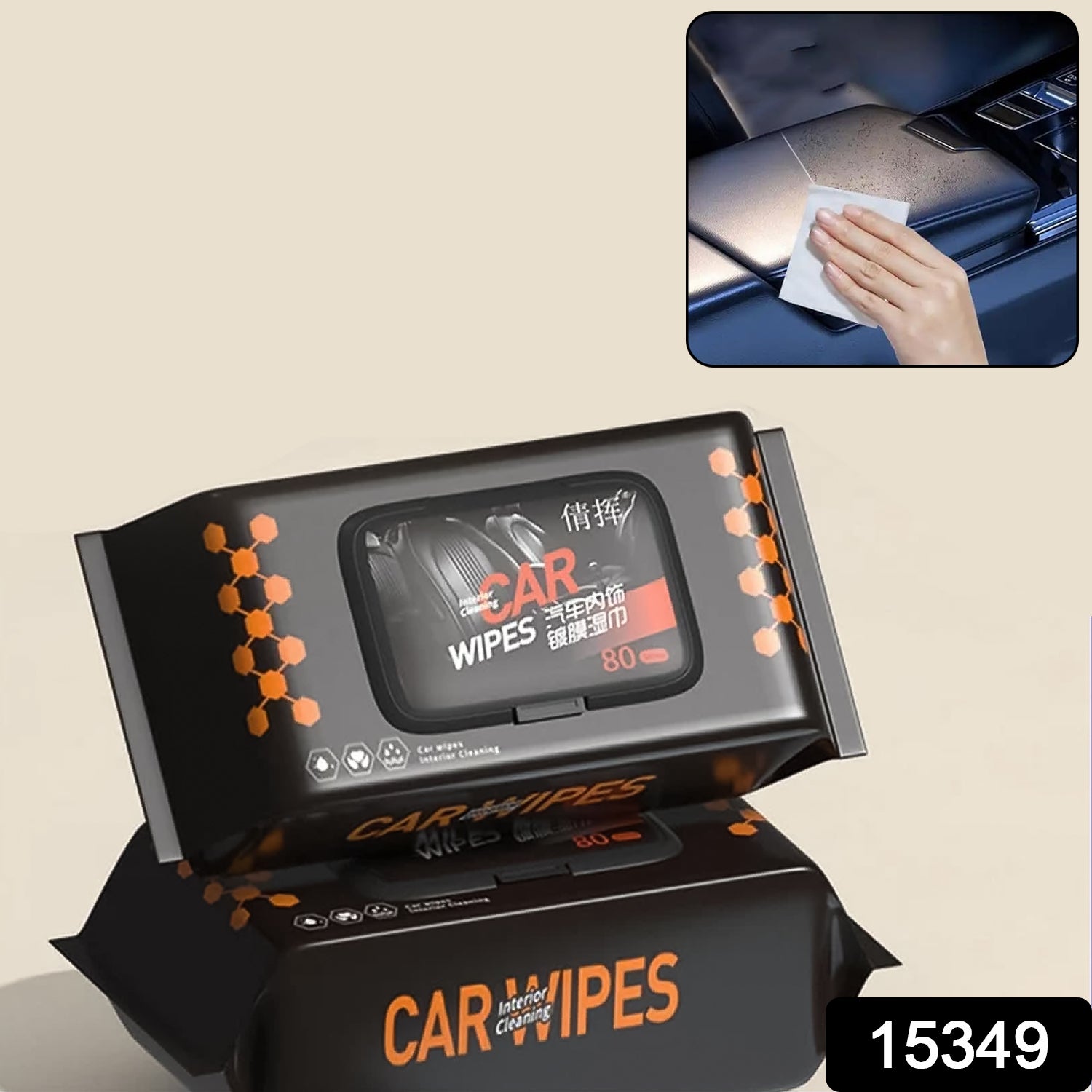 Two black packs of car wipes with orange accents, one open, next to a hand cleaning a car dashboard.