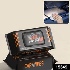 Two black packs of car wipes with orange accents, one open, next to a hand cleaning a car dashboard.