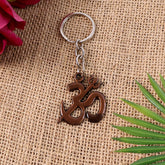 Om Trishul keychain with a smooth metallic finish and spiritual symbols