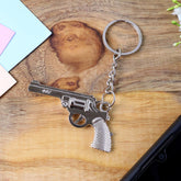 Sleek metallic gun shape keychain displayed on a clean white background.
