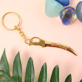 Front view of golden Mataji sword keychain with shiny gold finish