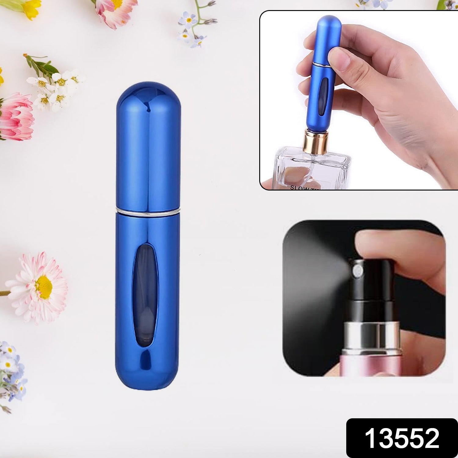 A blue refillable perfume atomizer with a clear window stands upright on a white surface with small flowers.