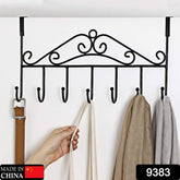 A black metal over-the-door hook rack with seven hooks, holding a brown belt, a white bag, and two scarves.