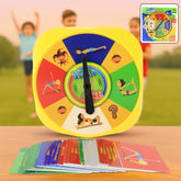 A yellow yoga spinner game with colorful sections and a black arrow, surrounded by a stack of yoga pose cards on a wooden