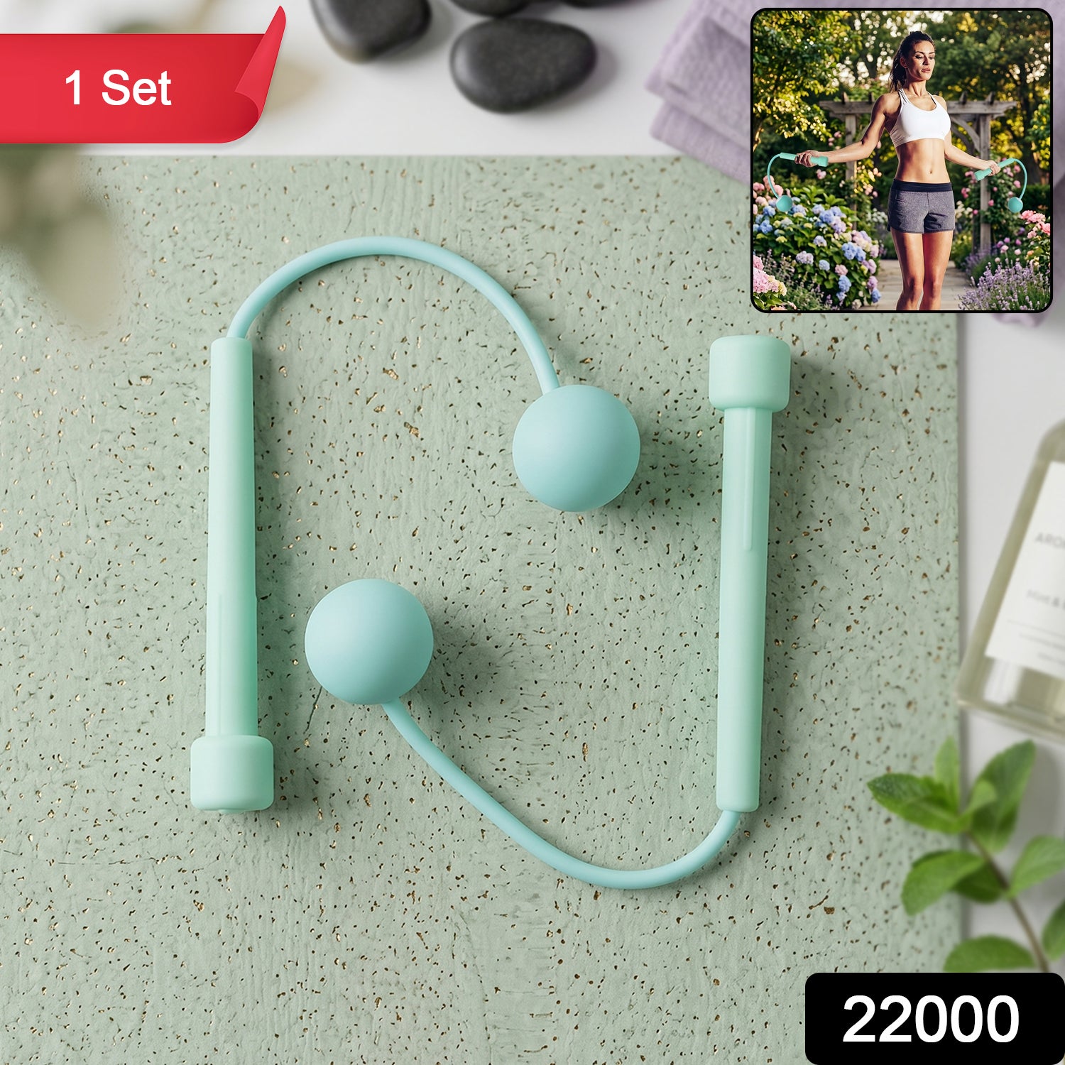 A mint green cordless jump rope with two weighted balls and handles lies on a textured green surface.