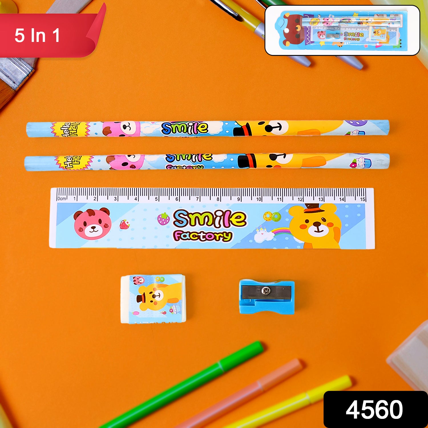 A five-piece stationery set with cartoon animal designs on an orange background, including two pencils, a ruler, an eraser,