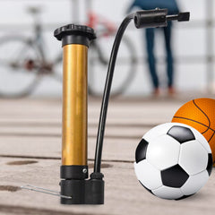 Two hands hold the gold and black hand pump, demonstrating its extendable black plunger and flexible hose.