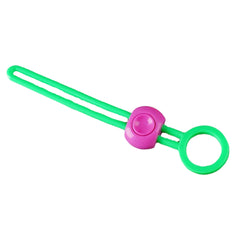 A green silicone bag clip with a pink button and a circular end is presented against a plain white background.