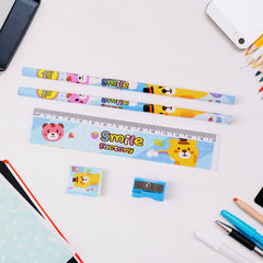 A five-piece stationery set with cartoon animal designs on a white background, surrounded by other colored pencils and a