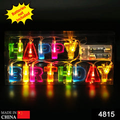 Illuminated multicolour plastic letters spelling "Happy Birthday" in a clear rectangular box with a battery pack.