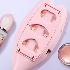 The underside of a pink leaf-shaped nail lamp reveals six small LED lights and a USB port.