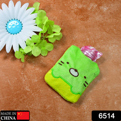 A green and yellow kitty hot water bag with a pink bottle, next to a white flower.