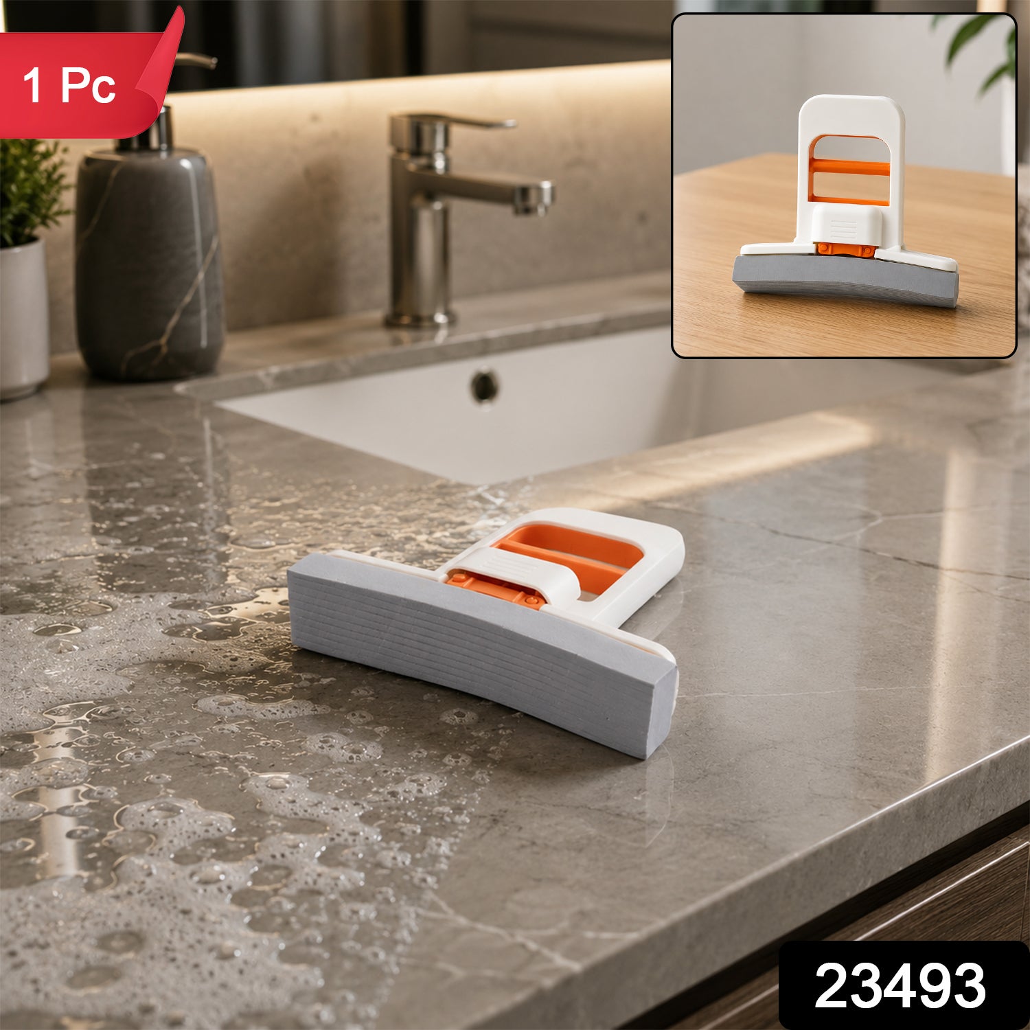 A white and orange mini sponge mop rests on a wet, bubbly grey marble countertop next to a sink. The inset shows the mop on