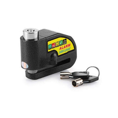 A black textured disc brake alarm lock with a yellow label and two silver-tipped keys on a white surface.