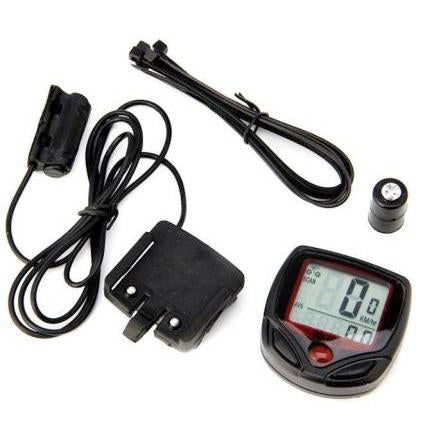 A black and red bicycle computer kit with wires, sensor, and zip ties arranged on a white surface.