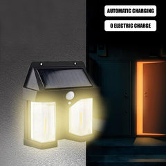 The black solar wall lamp glows brightly on a wall, contrasting with a dark doorway, showing its automatic function.