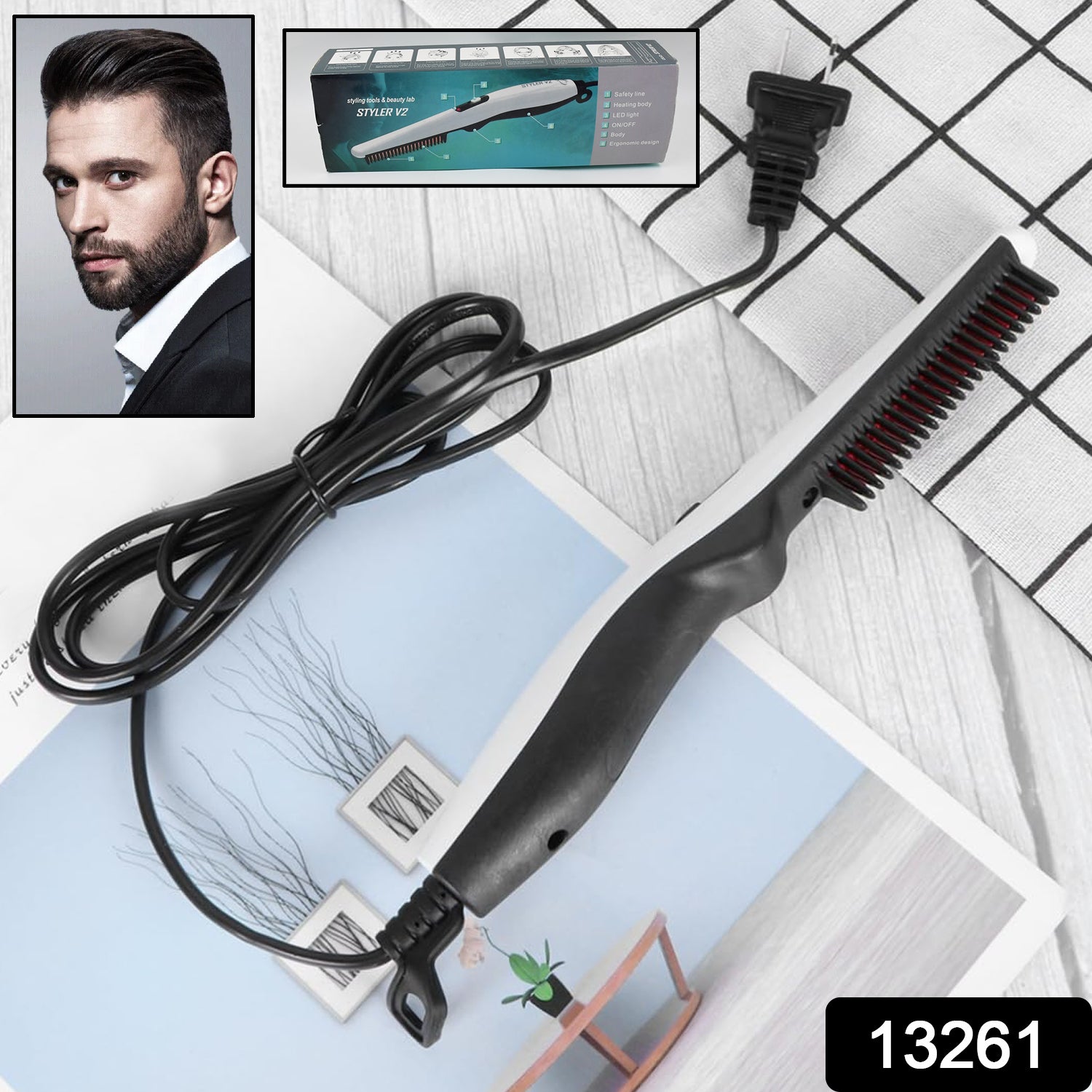 A black electric hair and beard straightening comb with a long cord and plug rests on a patterned white and blue surface,