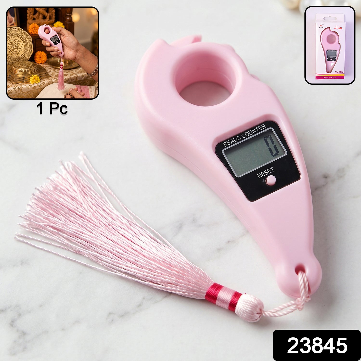 A pink digital finger counter with a tassel, displayed on a white marble surface, with a small inset showing it in use and