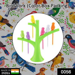 A green tree holder with colorful bird fruit forks, shown within a circular frame on a background of bird illustrations.