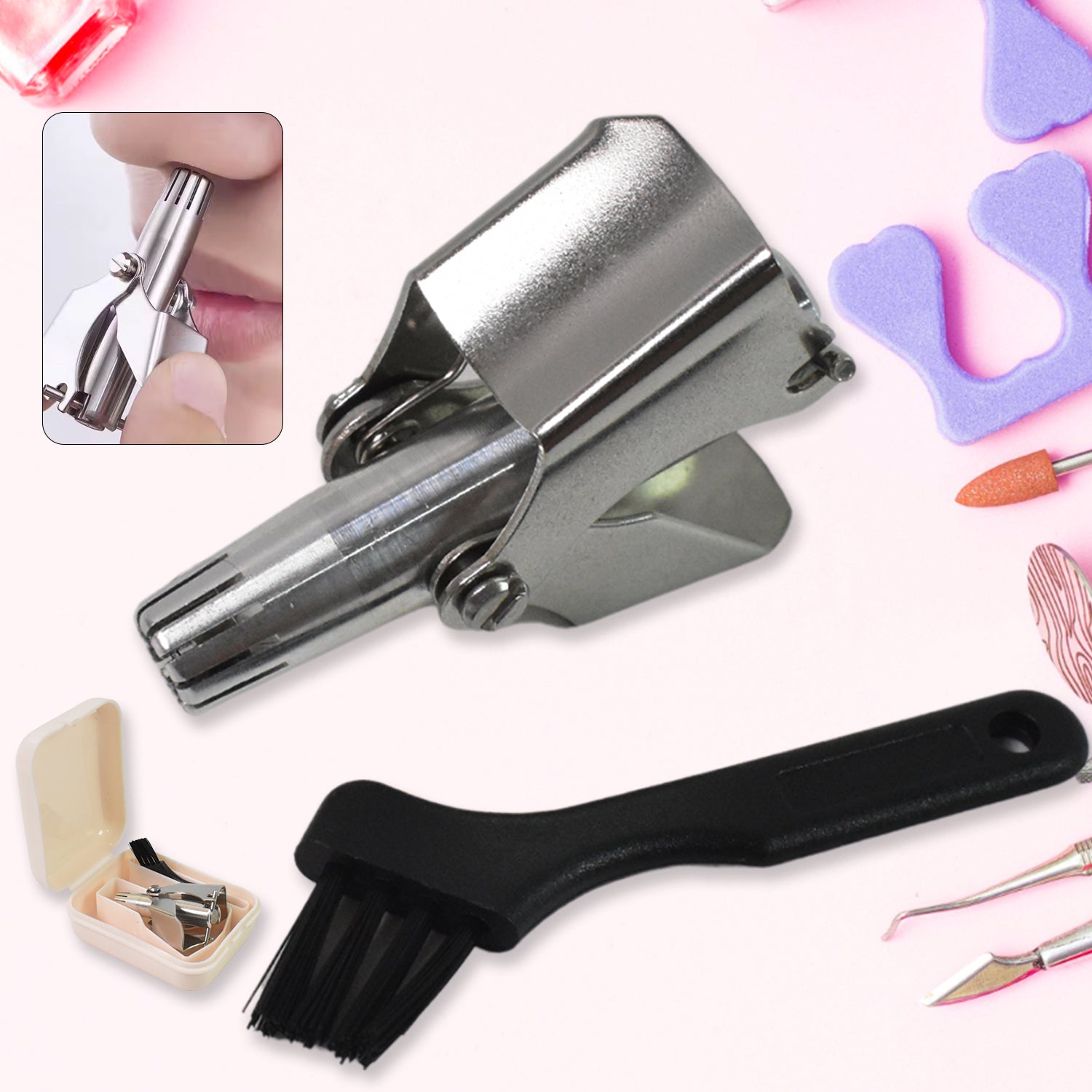 A silver manual nose hair trimmer, black brush, and small beige case are on a pink background with nail tools.