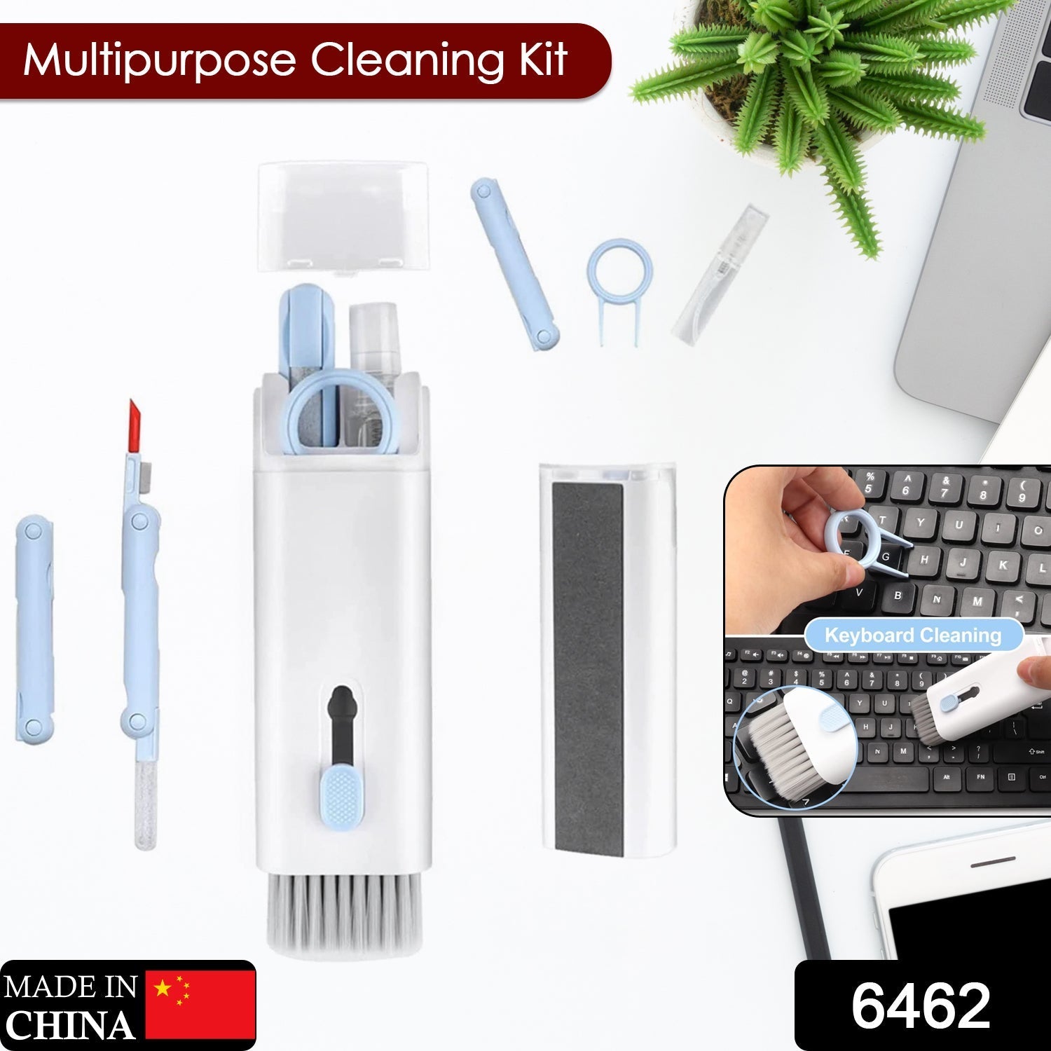 A white and light blue 7-in-1 electronic cleaning kit with tools laid out on a white desk with a laptop and plant.