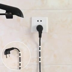 A black power cord secured to a light-colored tiled wall with five white cable clips, plugged into a white wall socket.