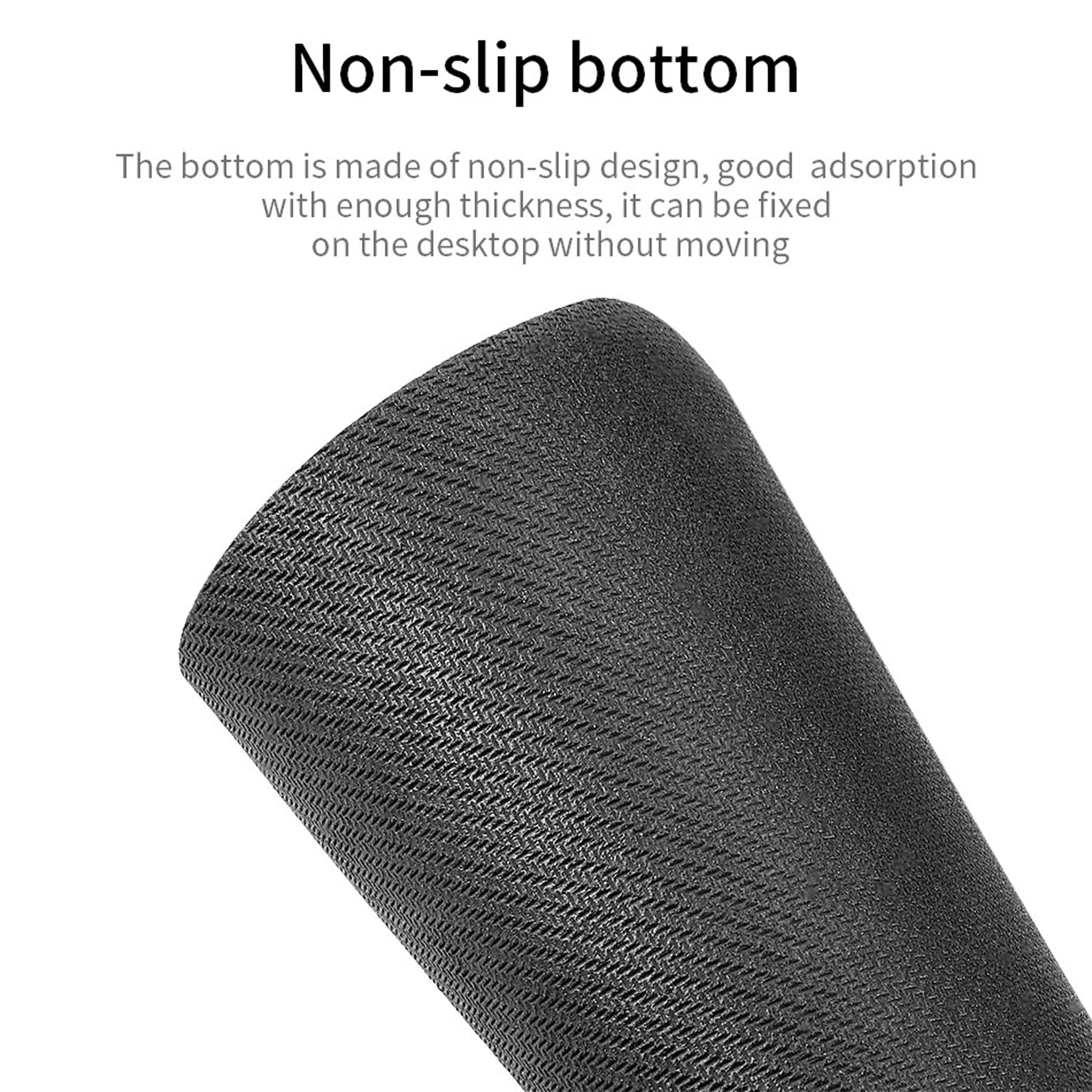 A close-up of the textured non-slip bottom of a black mouse pad.