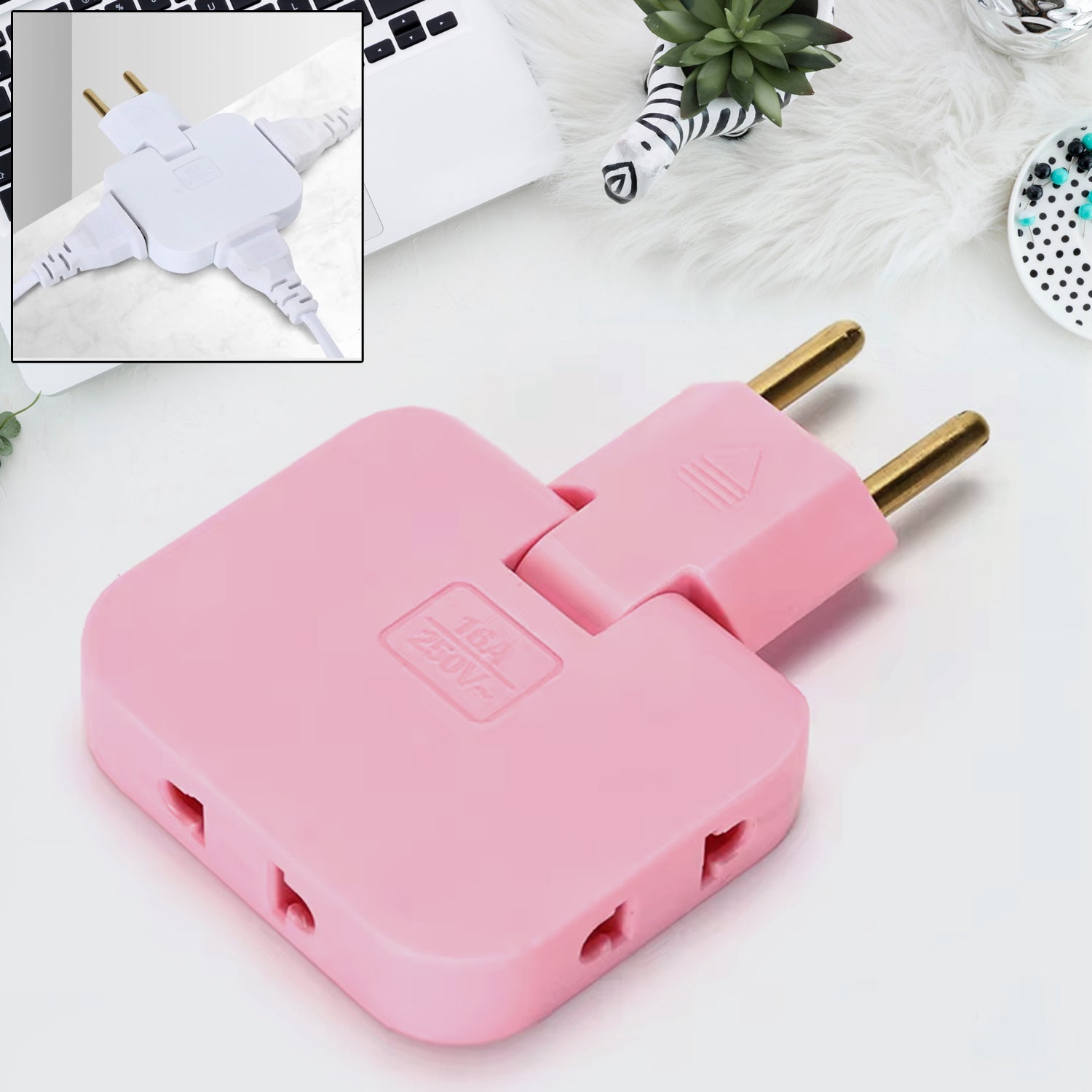Pink 3-in-1 foldable wall plug adapter on a desk with a laptop and plant. Inset shows a white version with three cords