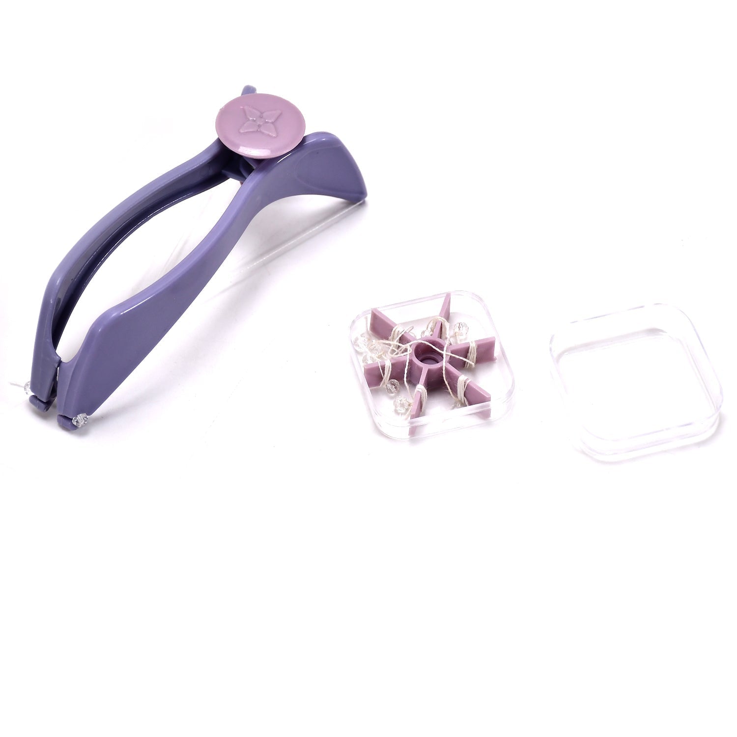 A purple hair threading tool and a clear container with purple thread spools, on a white background.
