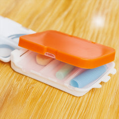 Open dual-sided pill organizer with 8 compartments for tablets and capsules
