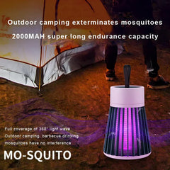 A black and white Mosquito Killer Lamp with purple light sits on the ground in front of a camping tent at night.
