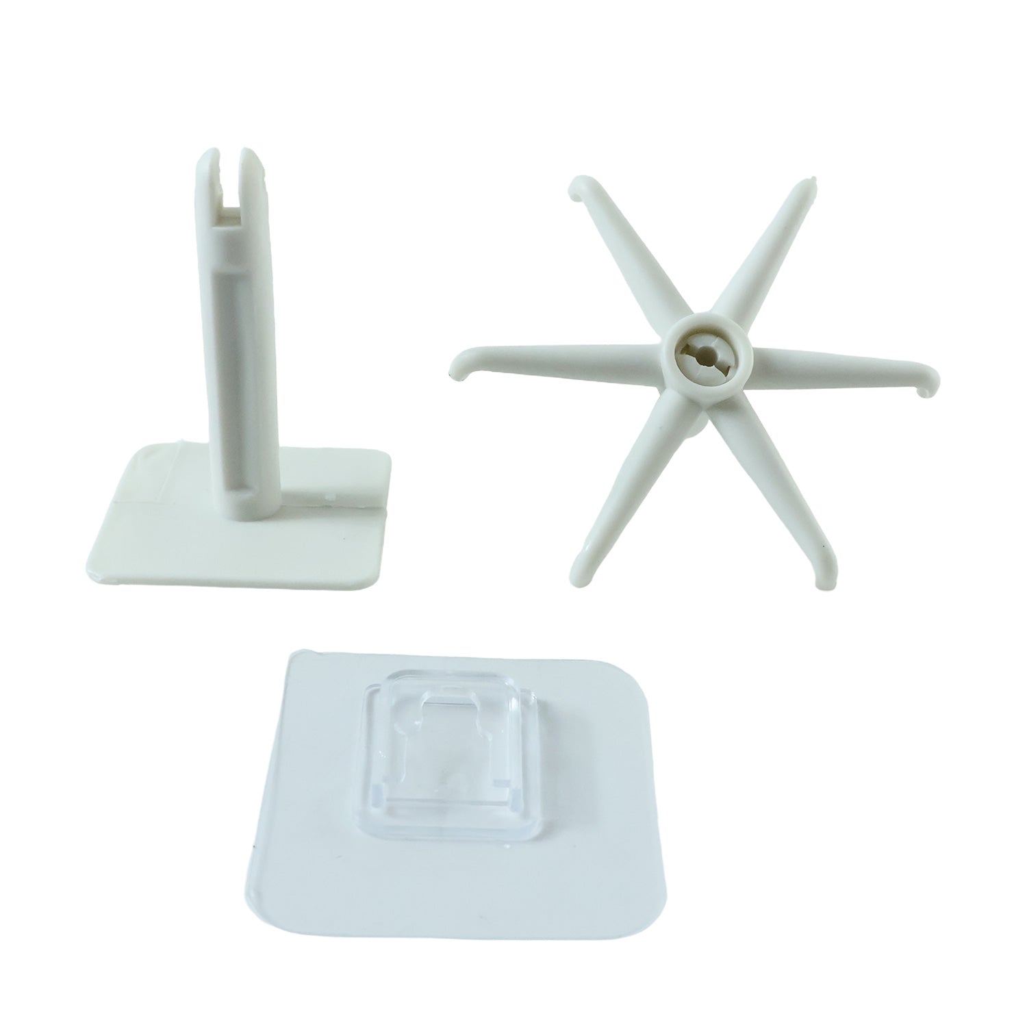 Three white plastic components of a rotating hook are arranged on a white background.